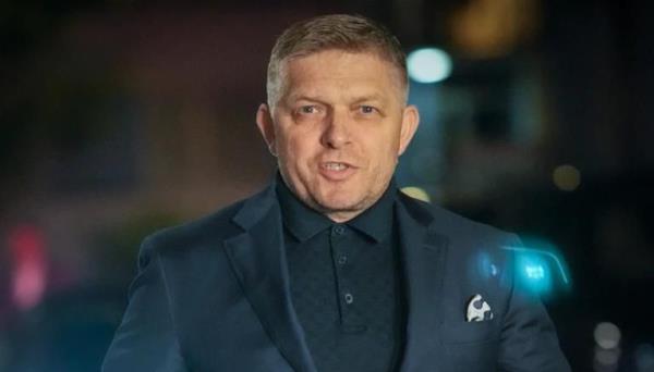 Former Prime Minister Robert Fico arrives to his party’s headquarters after polling stations closed for an early parliamentary election, in Bratislav